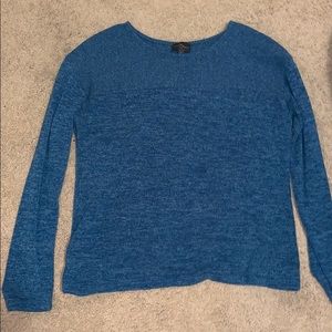 Sweater that is dark blue and has a button up back